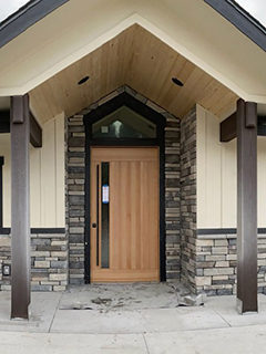 A sample of our work showing stonework surrounding the entry way of this home in North Idaho.